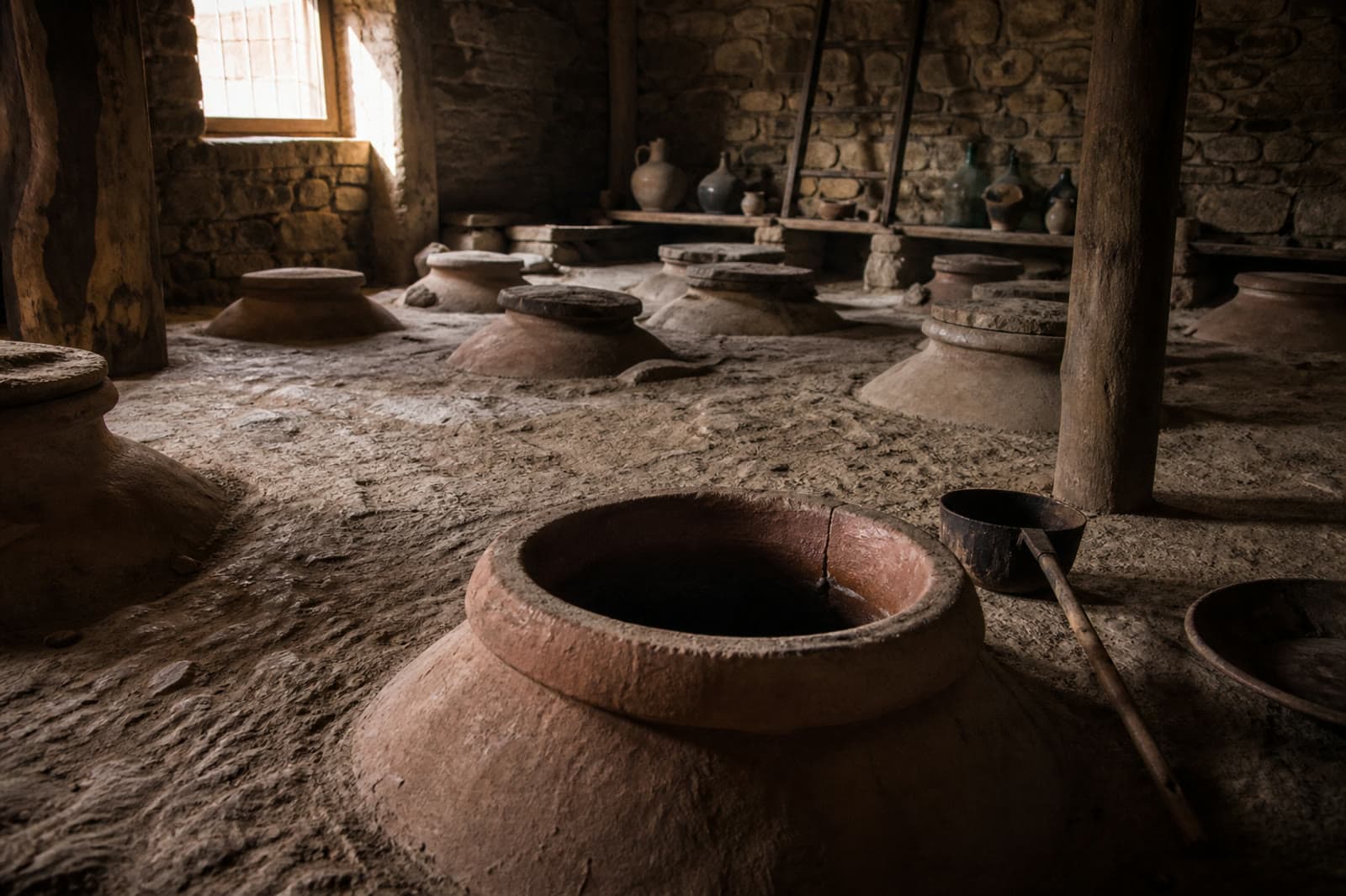 Traditional qvevri in a Georgian wine cellar